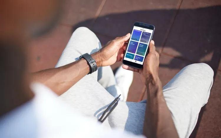 man using his phone to access mental health help