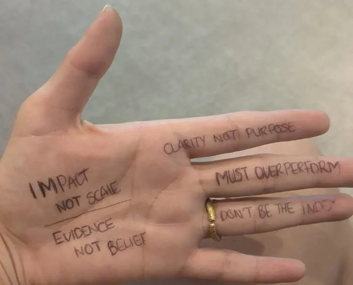 open hand with ink text